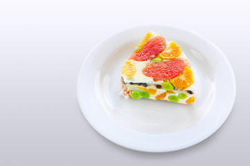 Piece of a colorful jelly cake with fruits