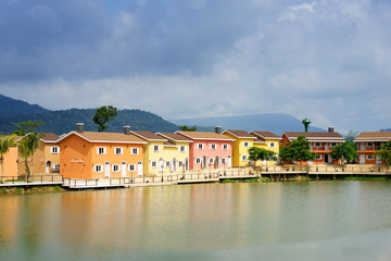 Fototapeta na wymiar Colorful houses near lake in Thailand