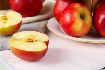 Naklejka na ściany i meble Tasty ripe apples on table close up