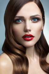 Fototapeta premium Portrait of beautiful girl with red lips.