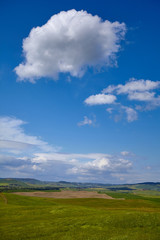 Scenic Tuscany landscape with rolling hills and beautiful clouds