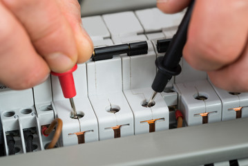 Technician Checking Fuse