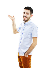 Friendly young man pointing to his side 