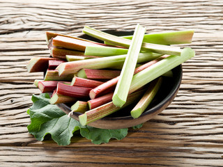 Rhubarb stalks on the wooden table.