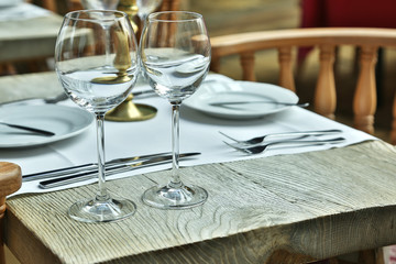 Table setting with wine glasses at the vintage cafe.