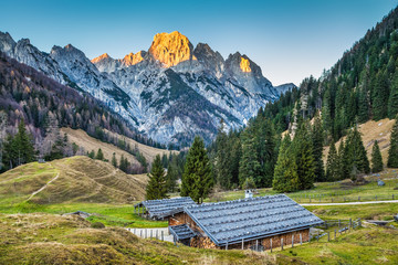 Mountain landscape in the Alps with chalets at sunset