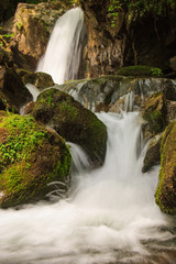 Beautiful small waterfall landscape in the mountains.