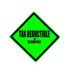 Obraz premium Tax deductible black stamp text on green background