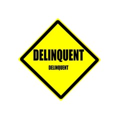 Delinquent black stamp text on yellow backgroud