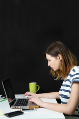 Young woman in front of laptop  - internet addiction concept