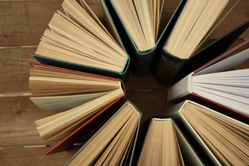 Naklejka premium Group of books on wooden background, top view