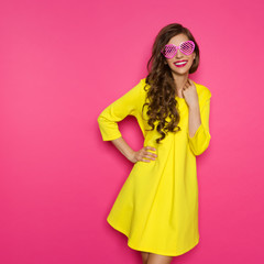 Cheerful Young Woman In Pink Sunglasses