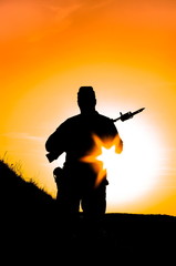 silhouette of a soldier at sunset