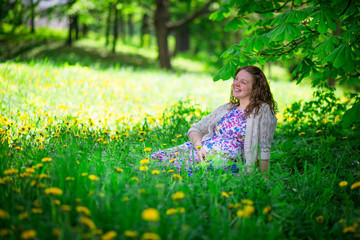 Pregnant woman in spring garden