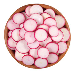 Red sliced radish in a wooden bowl on a white