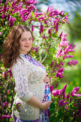 Pregnant woman in spring garden