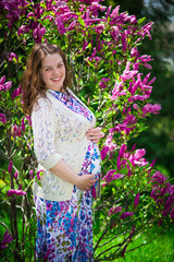 Pregnant woman in spring garden
