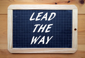 The phrase Lead The Way written on a blackboard