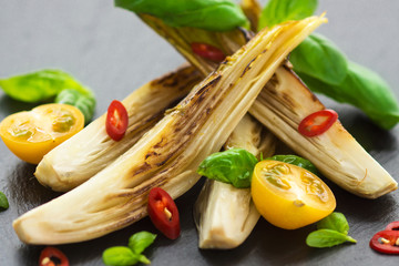 Roasted witlof on black stone