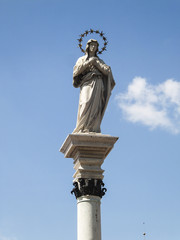 Fototapeta na wymiar Statue Of Our Lady Of The Immaculate Conception In The Middle Of