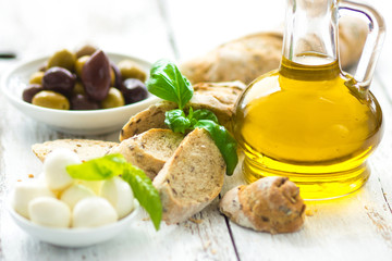 Bread and olive oil with snacks