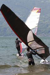 Windsurfers on Lake Como are preparing for departure