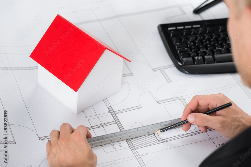 Poster close-up of architect making blueprint