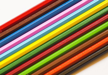 Colored pencils on white background, selective focus