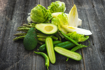 Green vegetables on wooden background macro