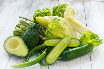 Green vegetables on wooden background macro