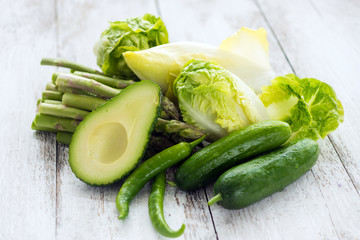 Green vegetables on wooden background macro