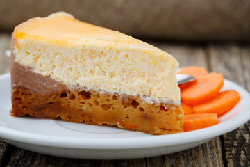 Sweet slice of carrot cake on white plate.