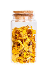 Sunflower petals in a bottle with cork stopper for medical use.