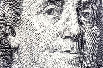 Portrait of Benjamin Franklin on one hundred dollar bill close-u