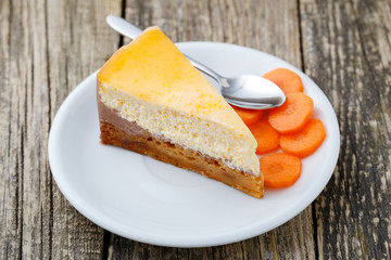 Sweet slice of carrot cake on white plate.