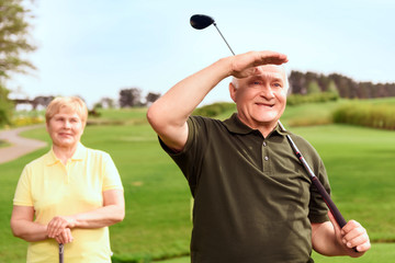 Man looking into the distance on course