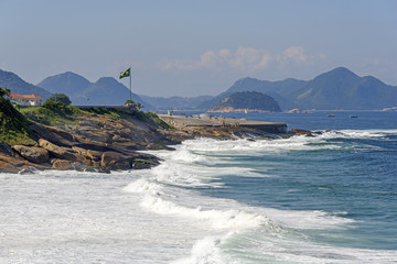 Devil beach in Ipanema and Copacabana fort in the background in Rio de Janeiro