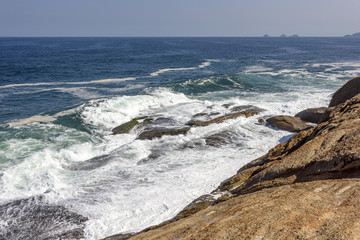 Waves breaking over rocks