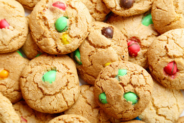 Cookies with colorful candy background