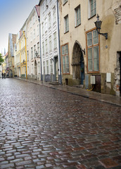 Naklejka na ściany i meble Old houses on the Old city streets. Tallinn. Estonia...