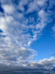 Blue sky with clouds. Nature background, dreams concept. 