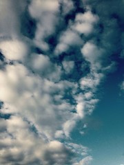 Blue sky with clouds. Dreams and afterlife concept, vintage.