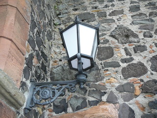 Lantern on the old stone wall