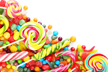 Fototapeta na wymiar Different fruit candies on white background