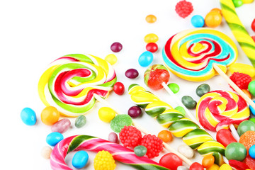 Fototapeta na wymiar Different fruit candies on white background