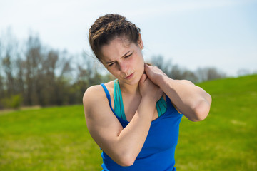 Young woman pain with neck injury .