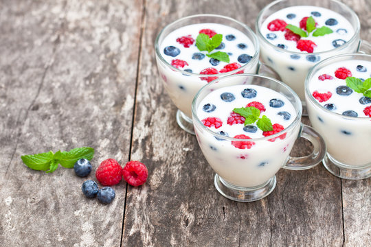 fresh milk with berries on the table