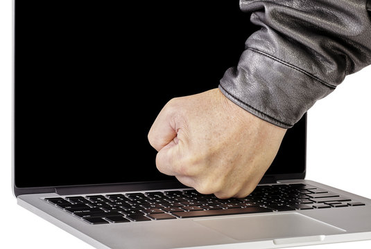 Man breaking laptop computer technology on white background
