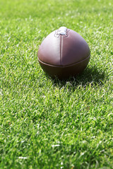 Rugby ball on green field