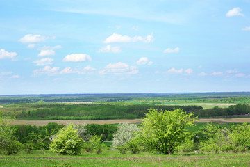 Fototapeta na wymiar Beautiful view of countryside over blue sky background